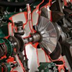 Detailed view of industrial machinery showcasing gears and cogs inside a mechanical system. - Photo by William Warby on Pexels